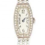 AN ART DECO DIAMOND AND PEARL COCKTAIL WATCH