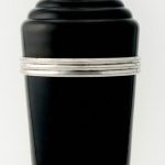 AN ENGLISH ART DECO BAKELITE AND SILVER-PLATED "MASTER INCOLOR" COCKTAIL SHAKER