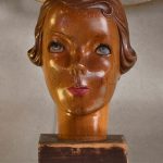 An Art Deco carved and painted wood female bust