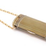 A French Art Deco gold, enamel, hardstone and diamond Minaudiere