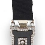 CHAUMET: ART DECO ONYX AND DIAMOND FOB WATCH, CIRCA 1925