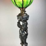 Large figural silver and art glass lamp